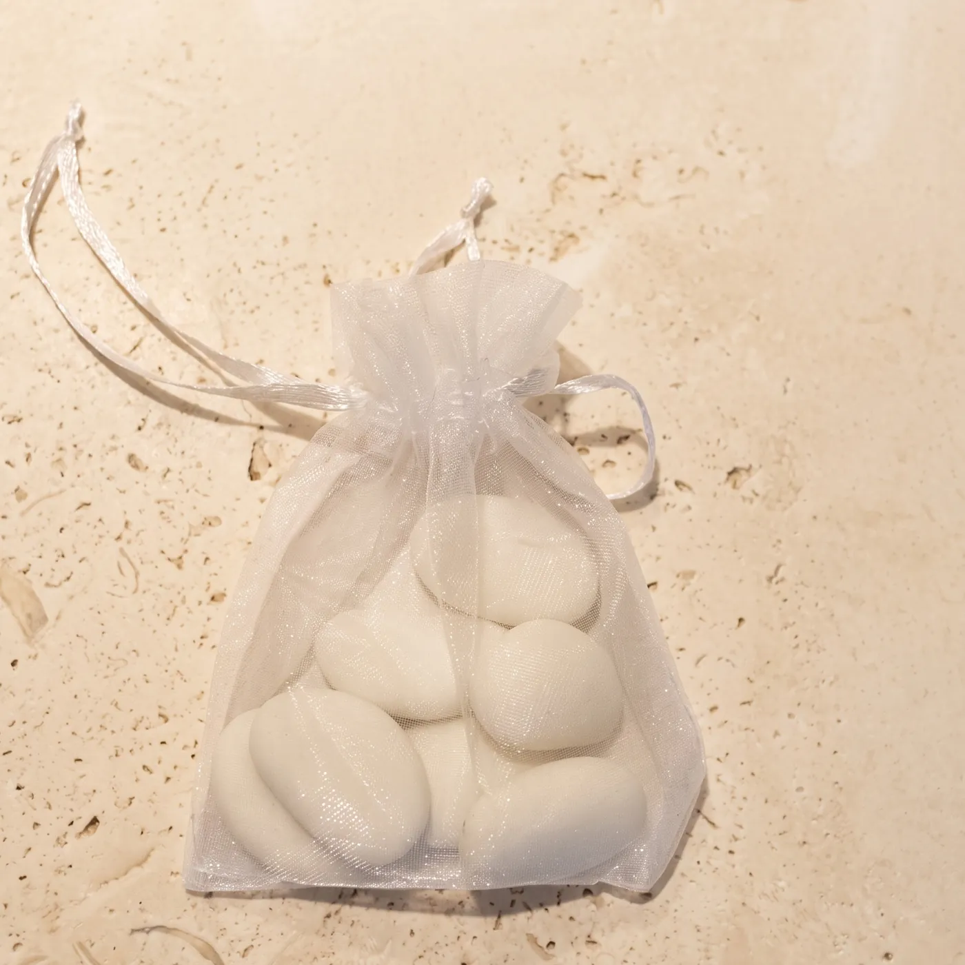 A small pouch of confetti — sugared almonds
