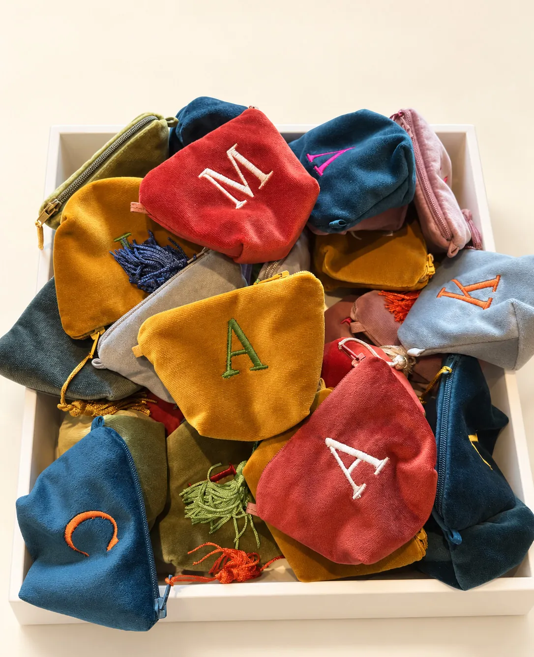Mini velvet pouches gathered on a tray